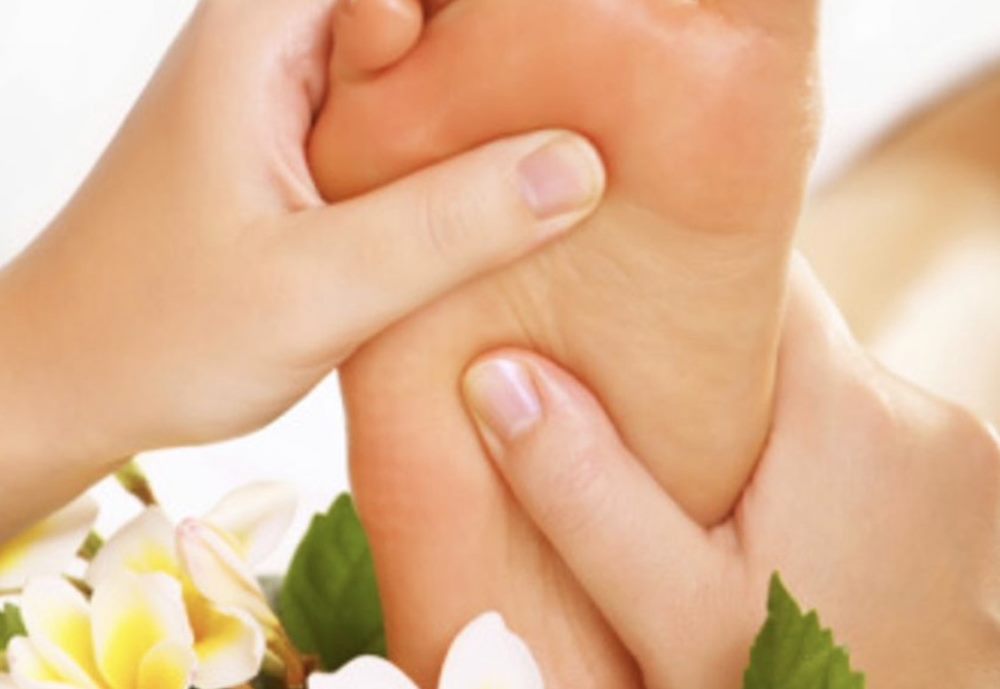 Thai foot massage and reflexology with frangipani flowers in Athlone